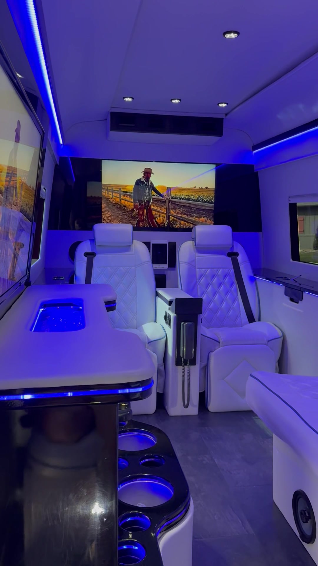 Blue hour ambiance inside the Sprinter with the party in full swing