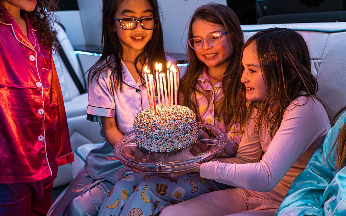 Birthday celebration setup inside the Social Luxury Sprinter with balloons and lounge seating